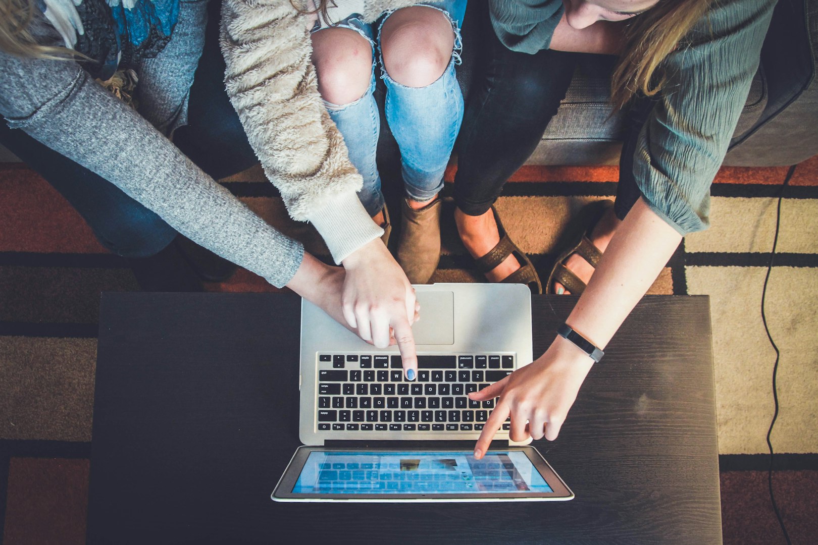 A team looking at data on a laptop